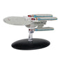 Model of a spaceship on a black base with a white background